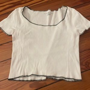 white cropped tee with black lining